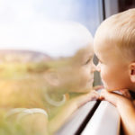 Boy Travelling On A Train